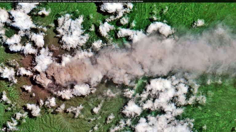 Faster Ash Cloud Modelling Helps Airlines Reroute Safely volcano erupting with an ash cloud over an island