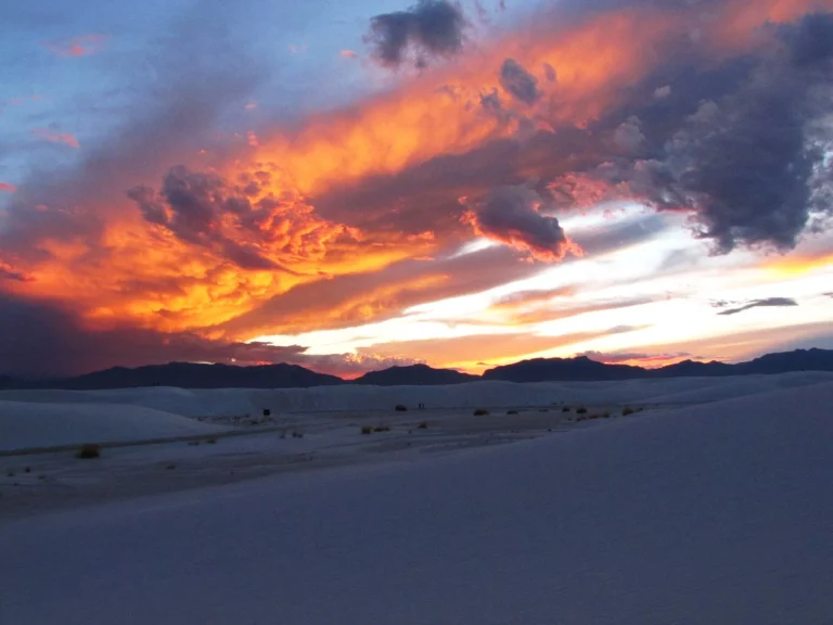 Sunset light glowing over the white dunes of White Sands National Park