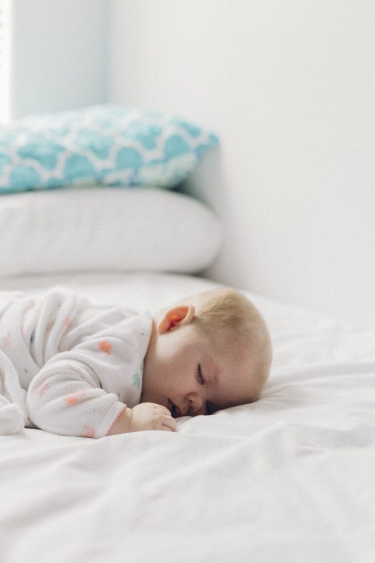 Regular Sleep Schedules Support Mood Focus and Wellbeing person sleeping peacefully in dark bedroom