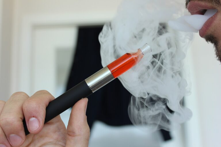 Vaping After Smoking Cessation: What Research Says About Lung Cancer Risk Graphic showing a cigarette crossed out beside an e-cigarette and lung imagery